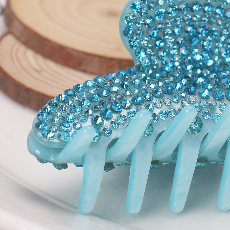 Handmade rhinestone claw within Blue
