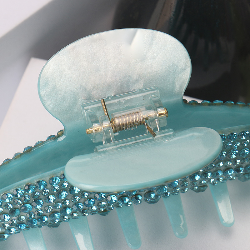 Handmade rhinestone claw within Blue