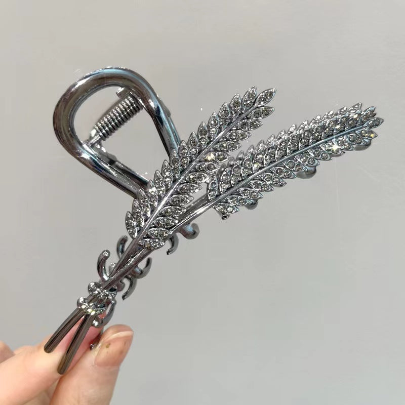 Ears of wheat claw within black