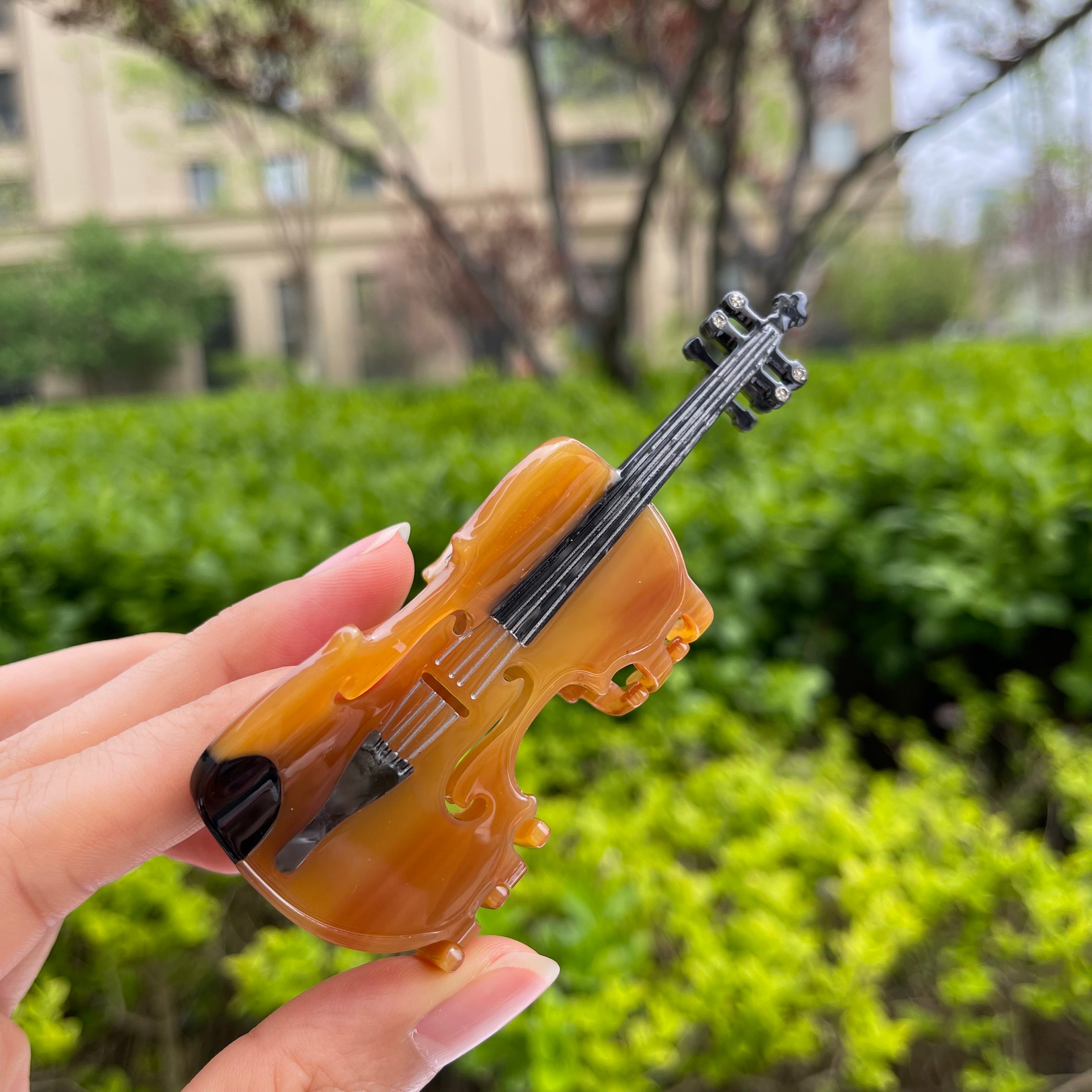 Brown violin hair claw