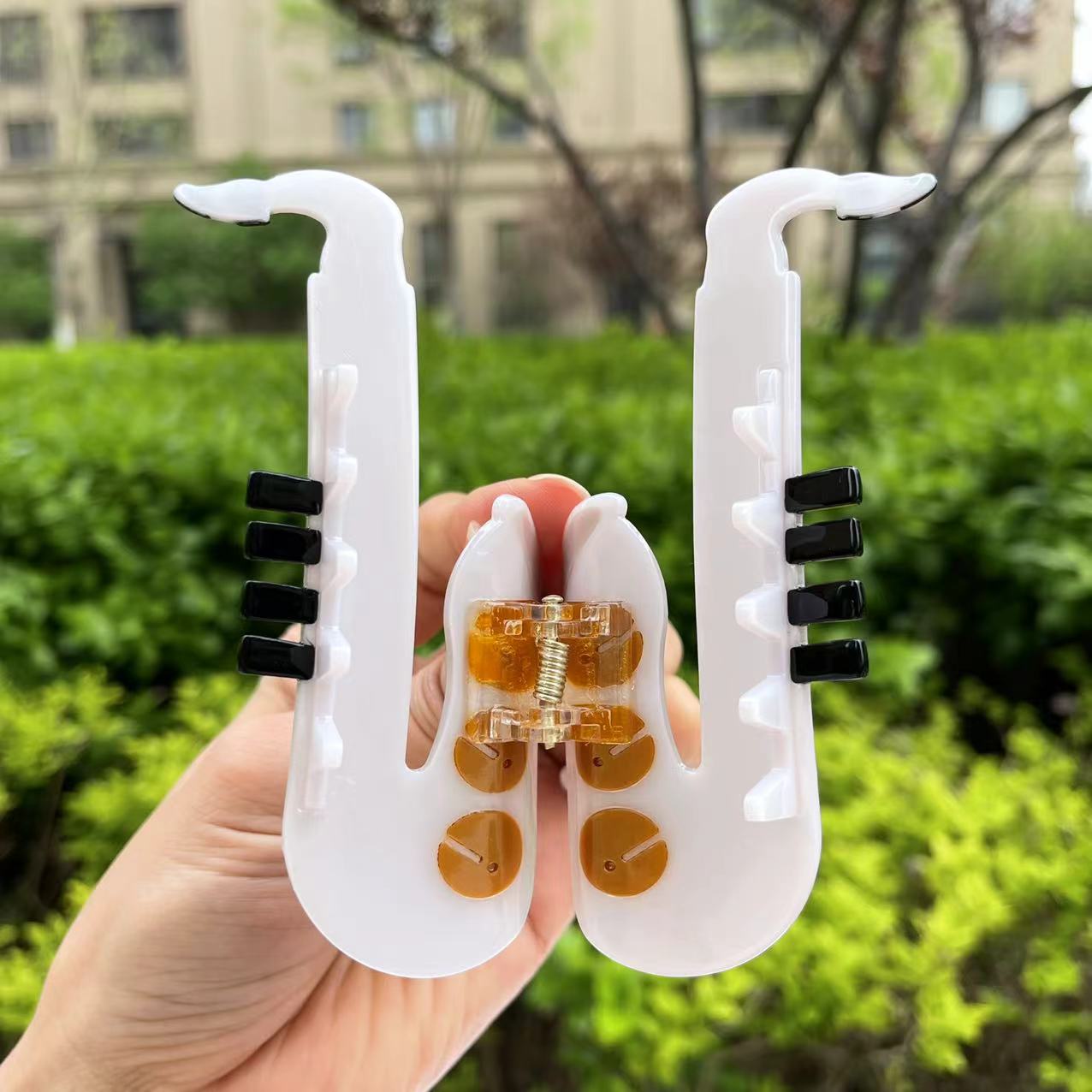 White saxophone hair claw