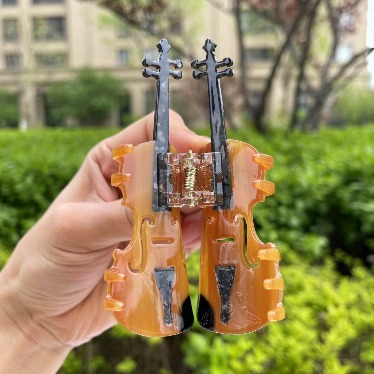 Brown violin hair claw