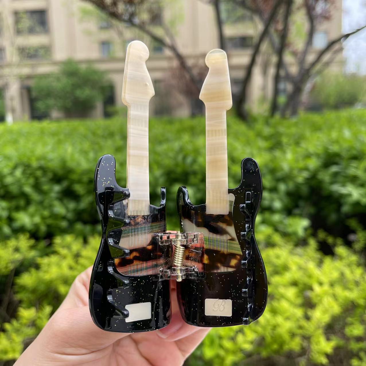 Comely black guitar hair claw