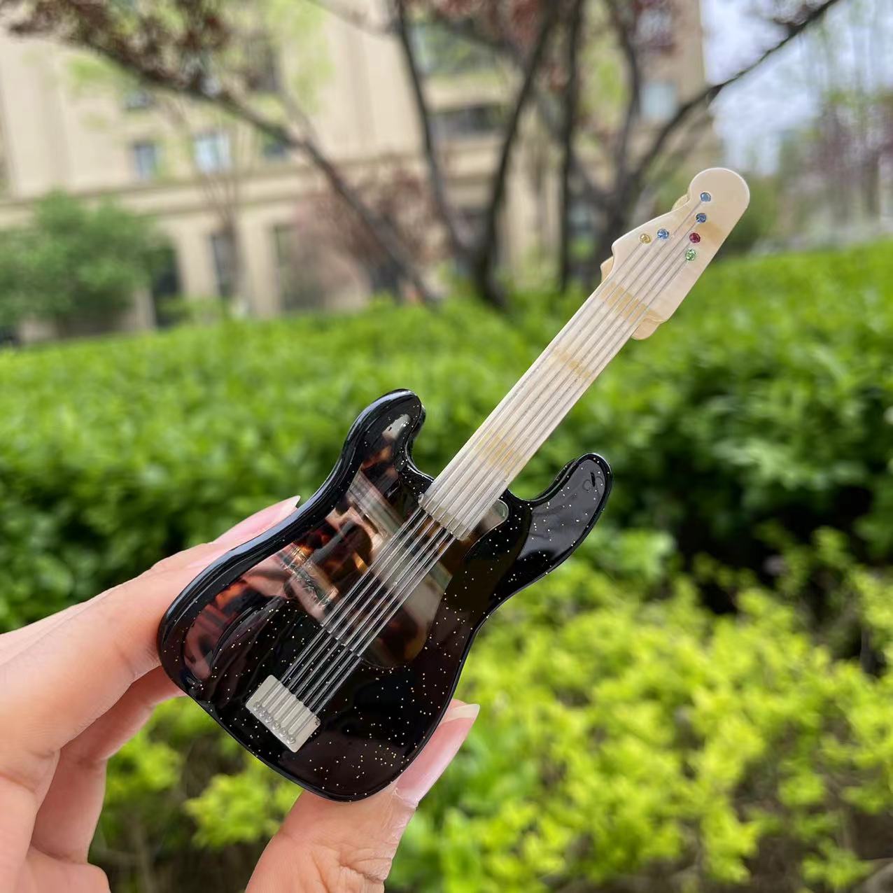 Comely black guitar hair claw