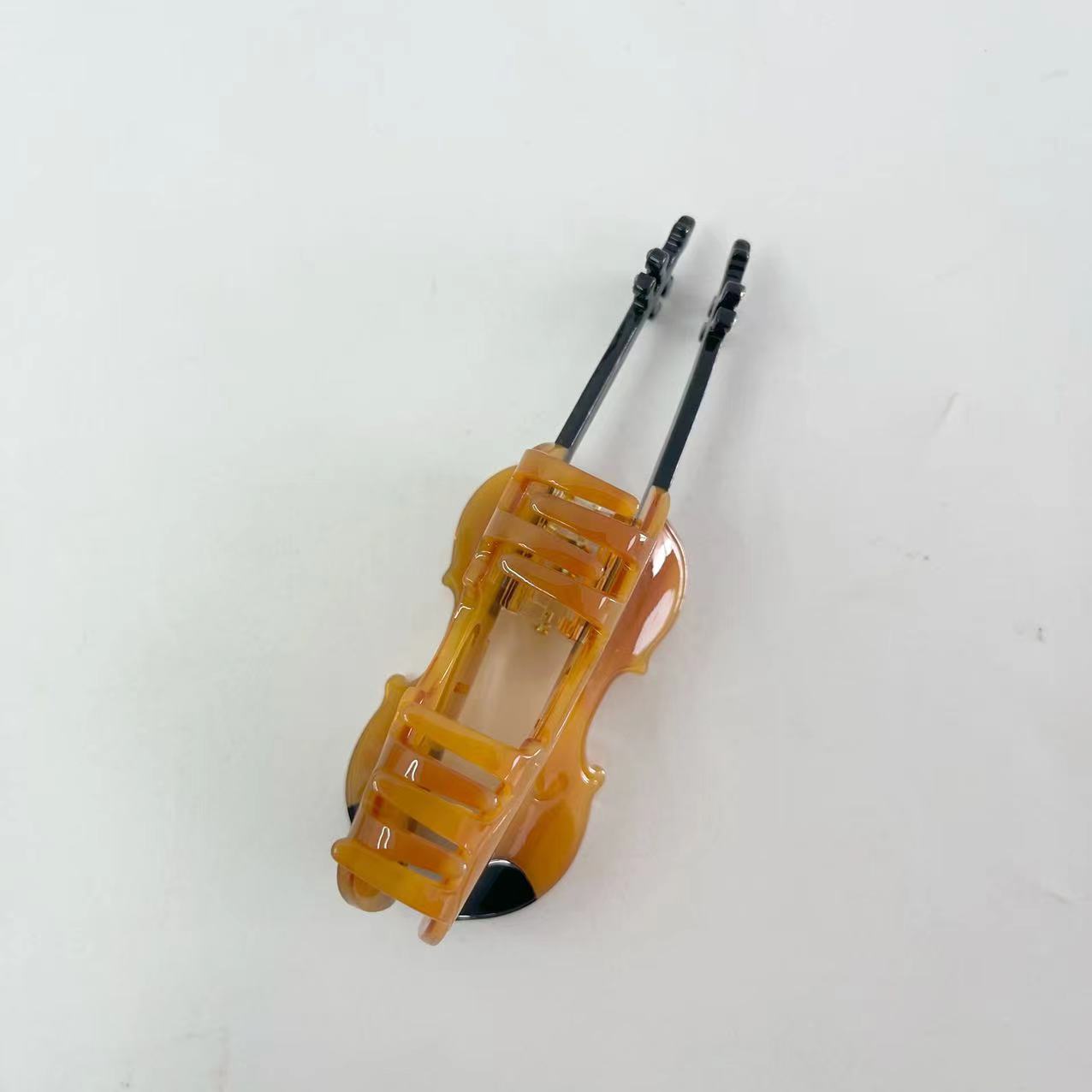 Brown violin hair claw