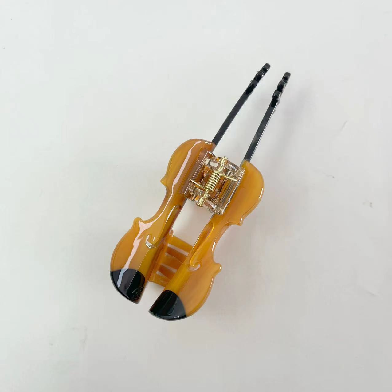 Brown violin hair claw