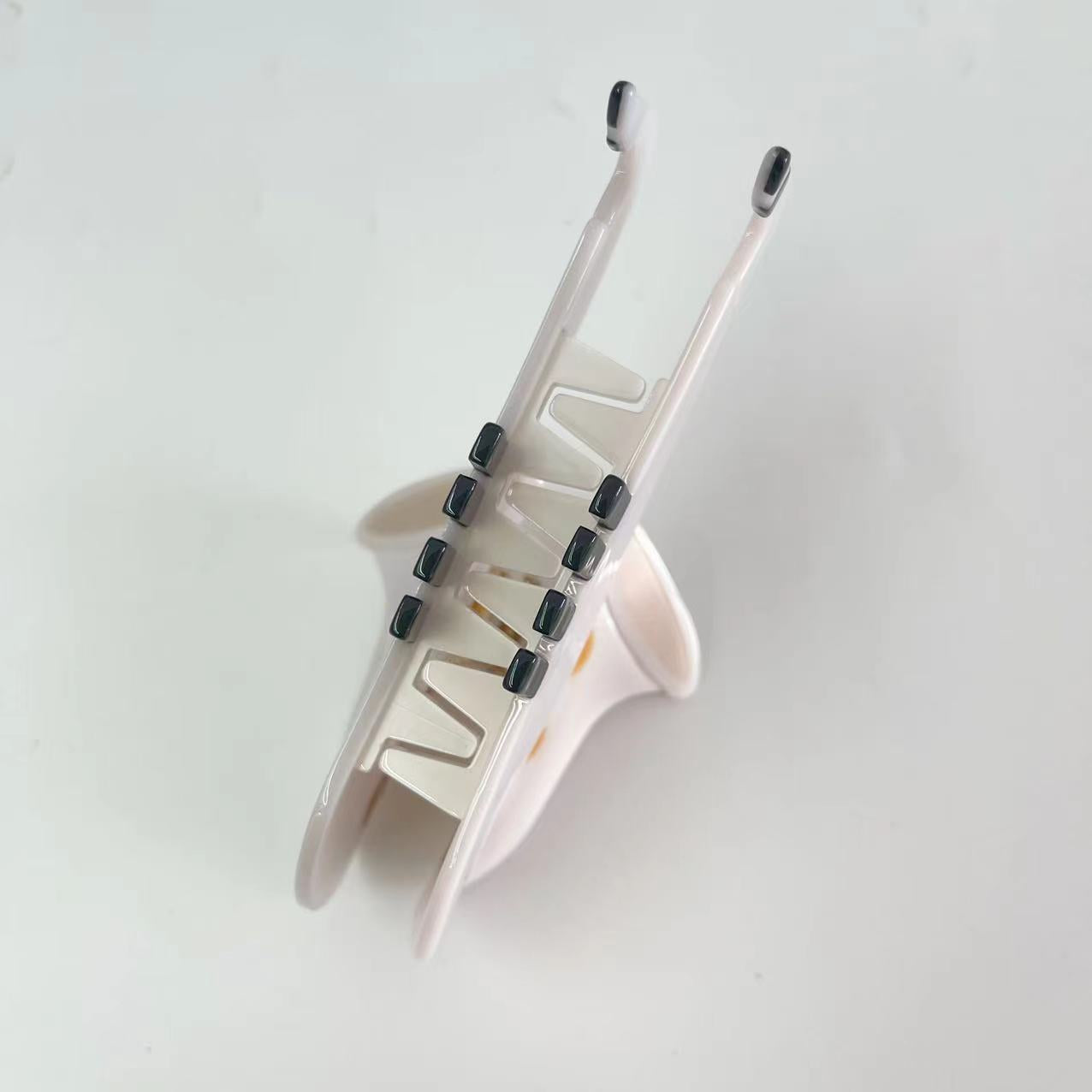 White saxophone hair claw