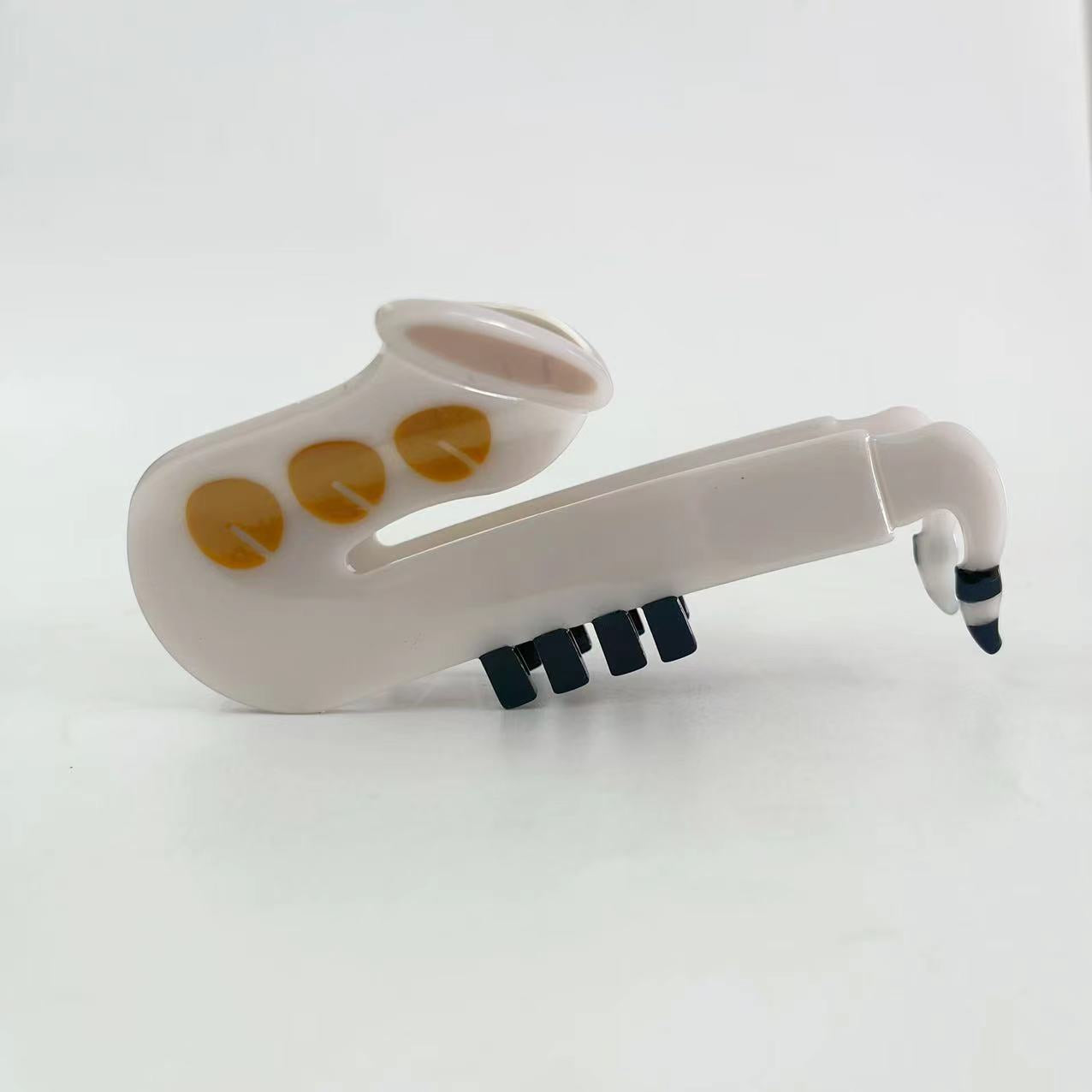 White saxophone hair claw