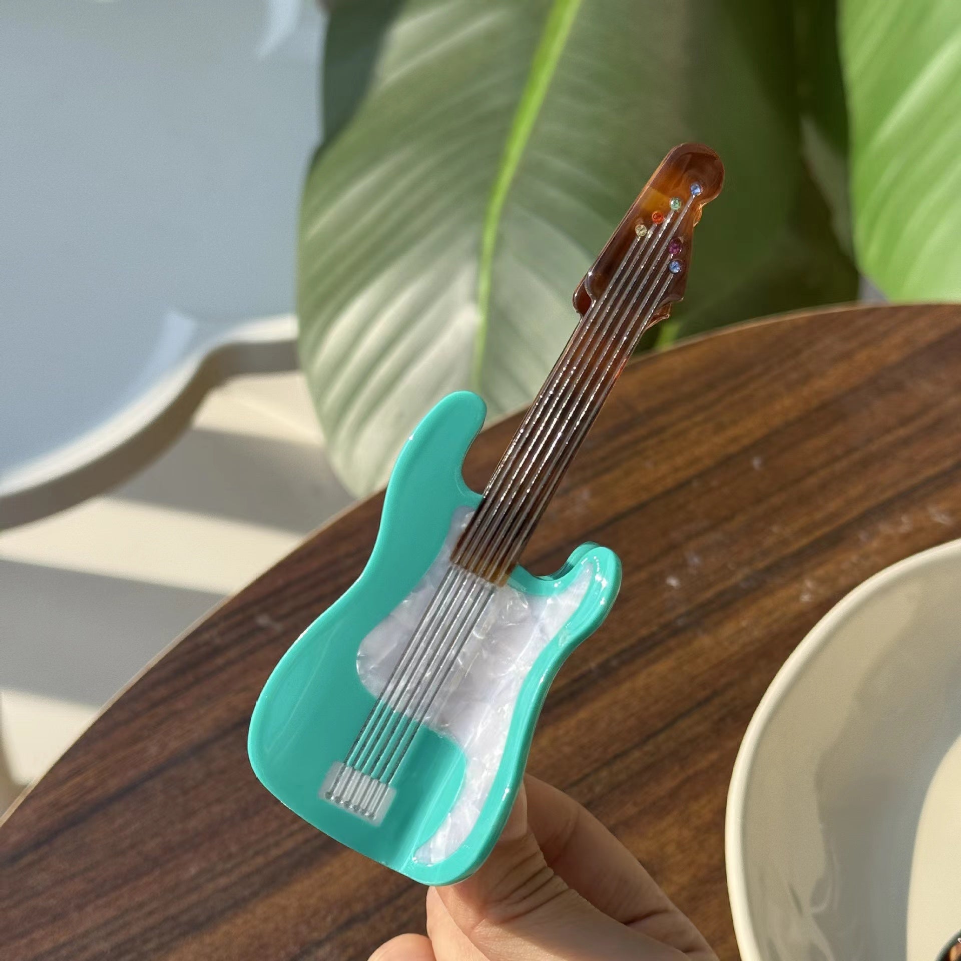 Mint green guitar hair claw