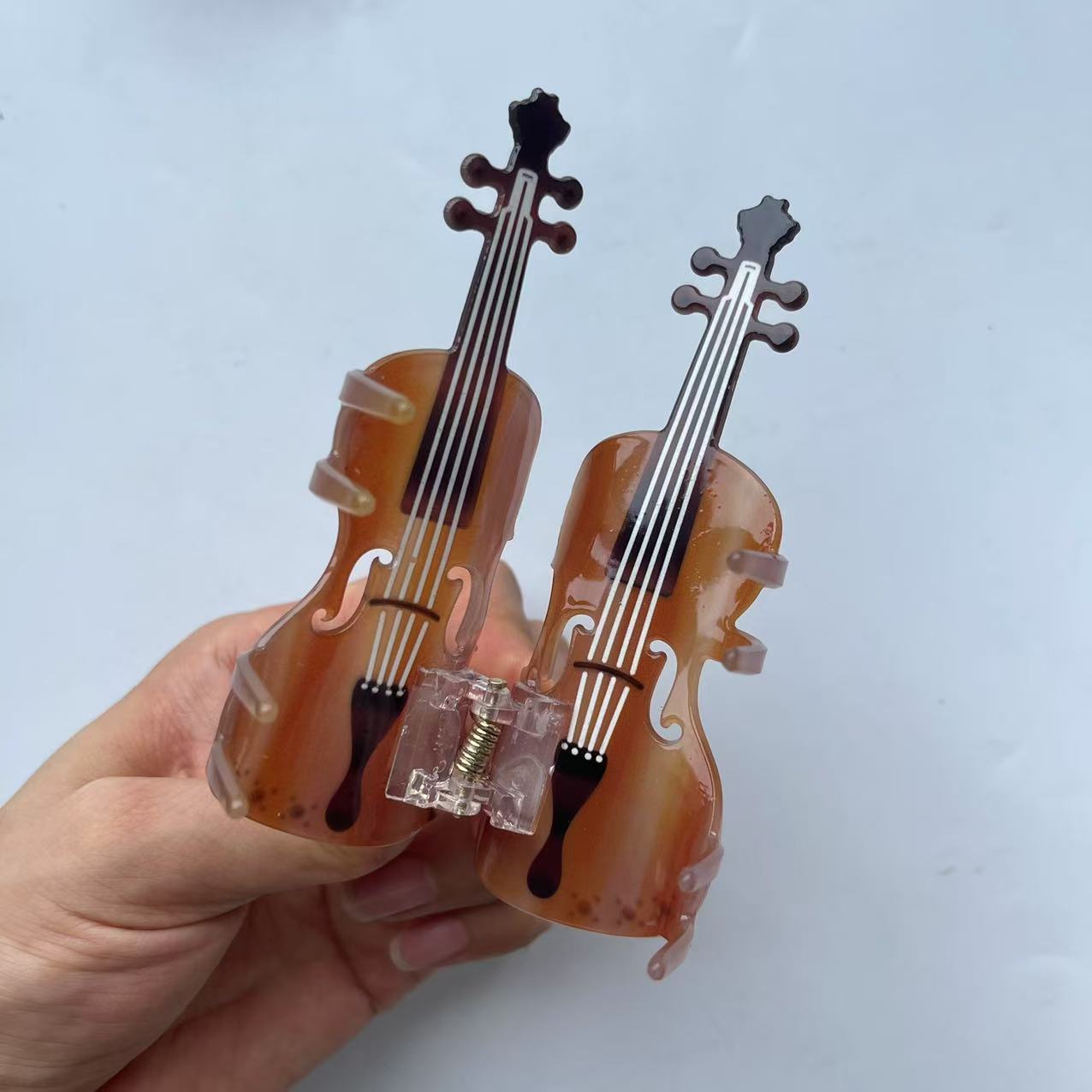 Diamond violin hair claw within brown