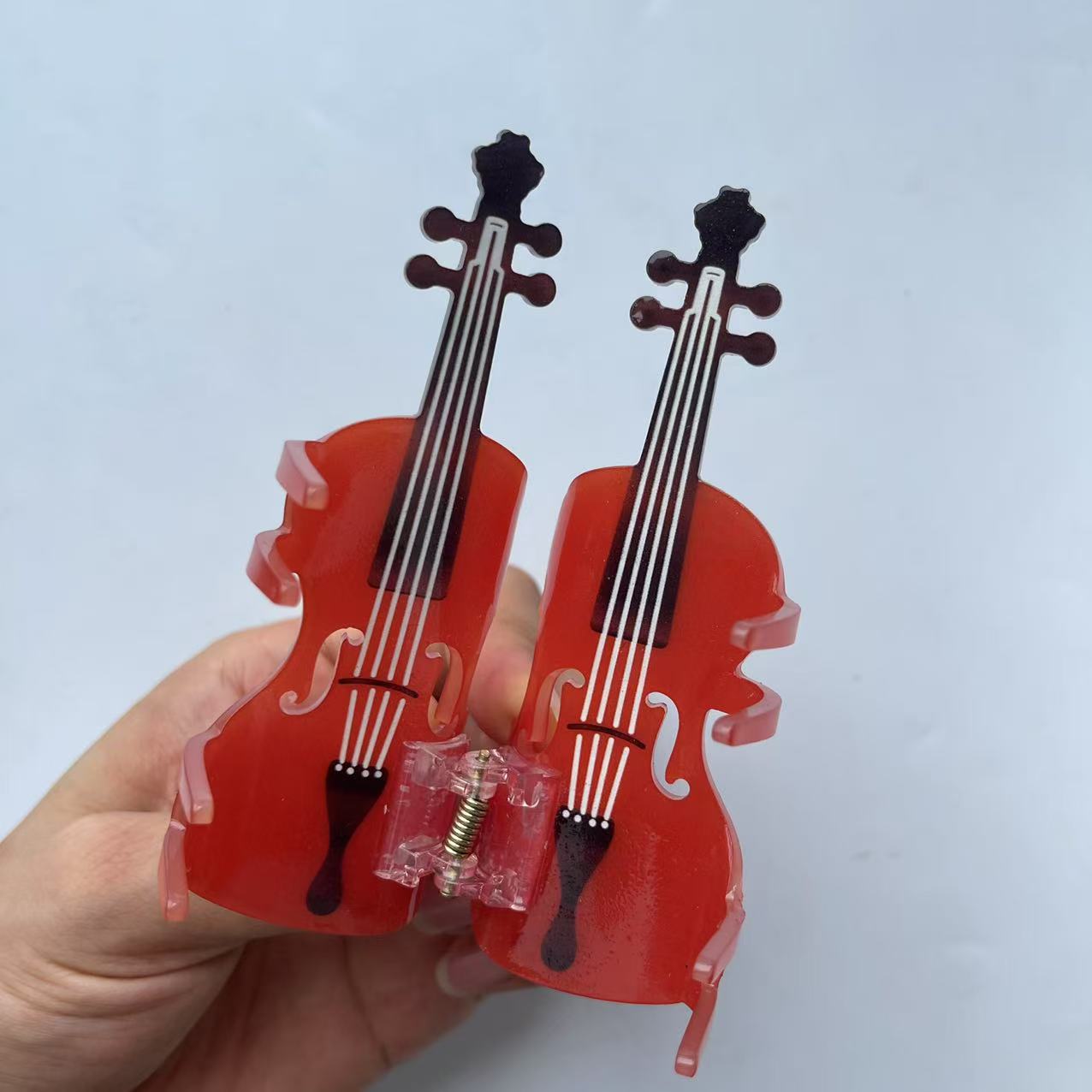 Diamond violin hair claw within red