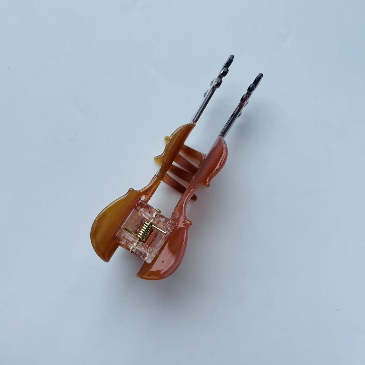 Diamond violin hair claw within brown