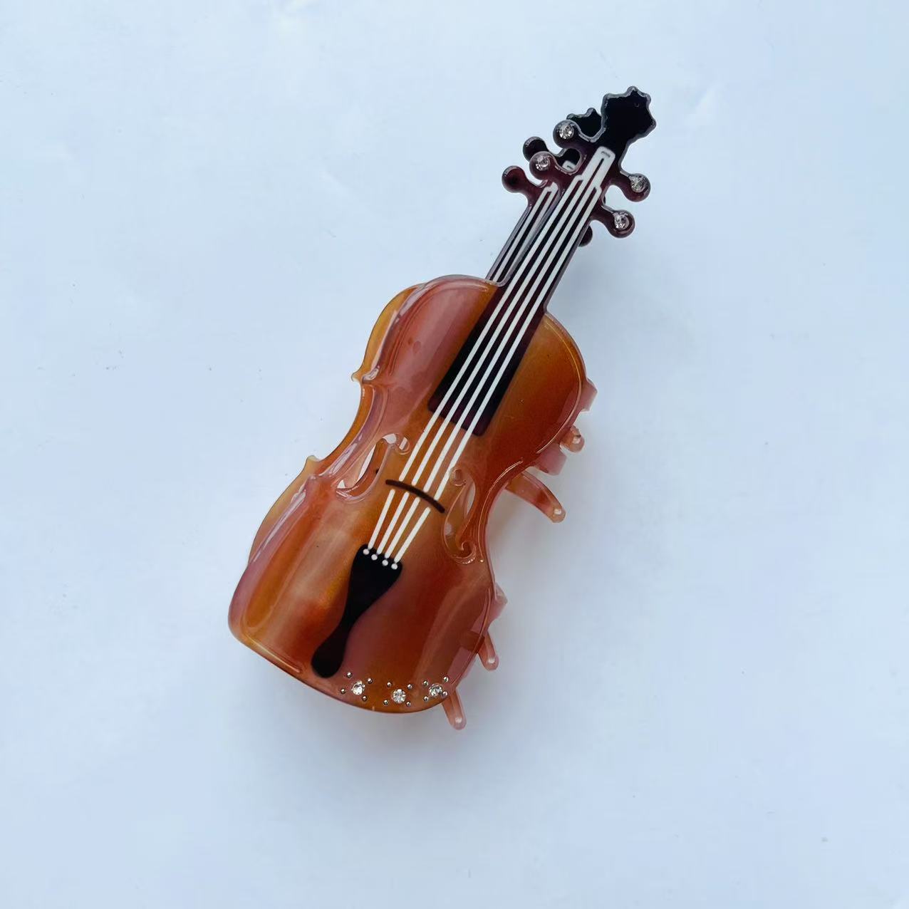 Diamond violin hair claw within brown