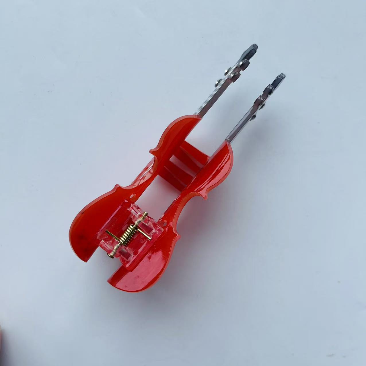 Diamond violin hair claw within red
