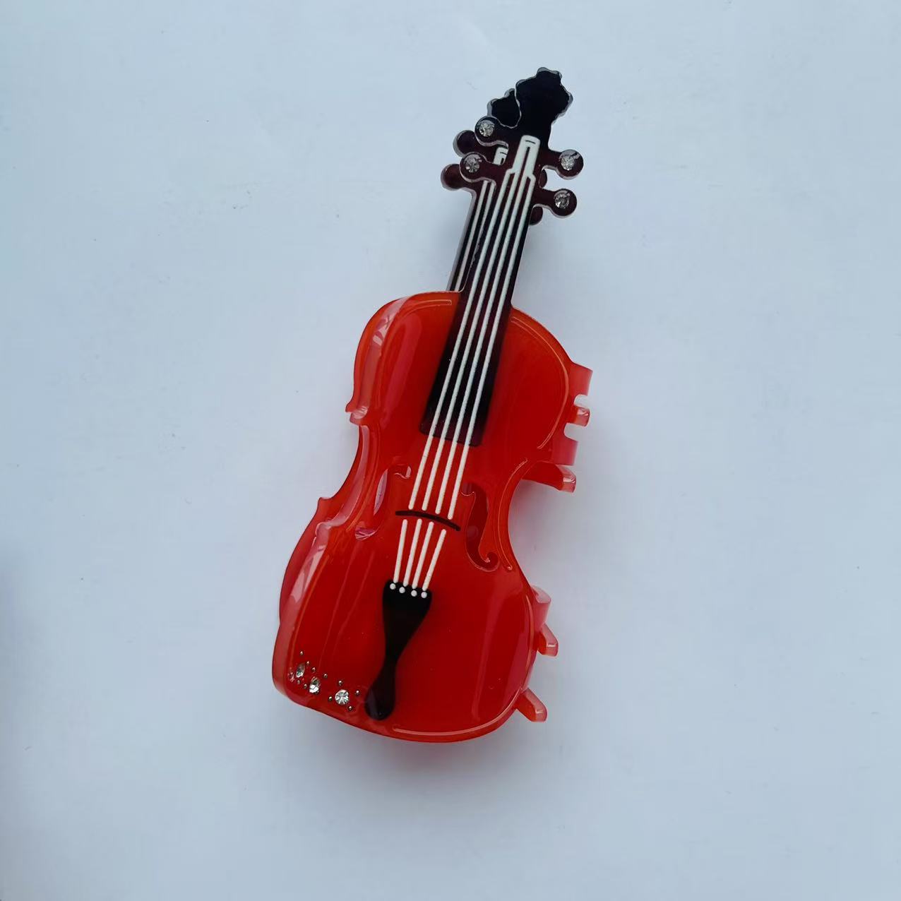 Diamond violin hair claw within red