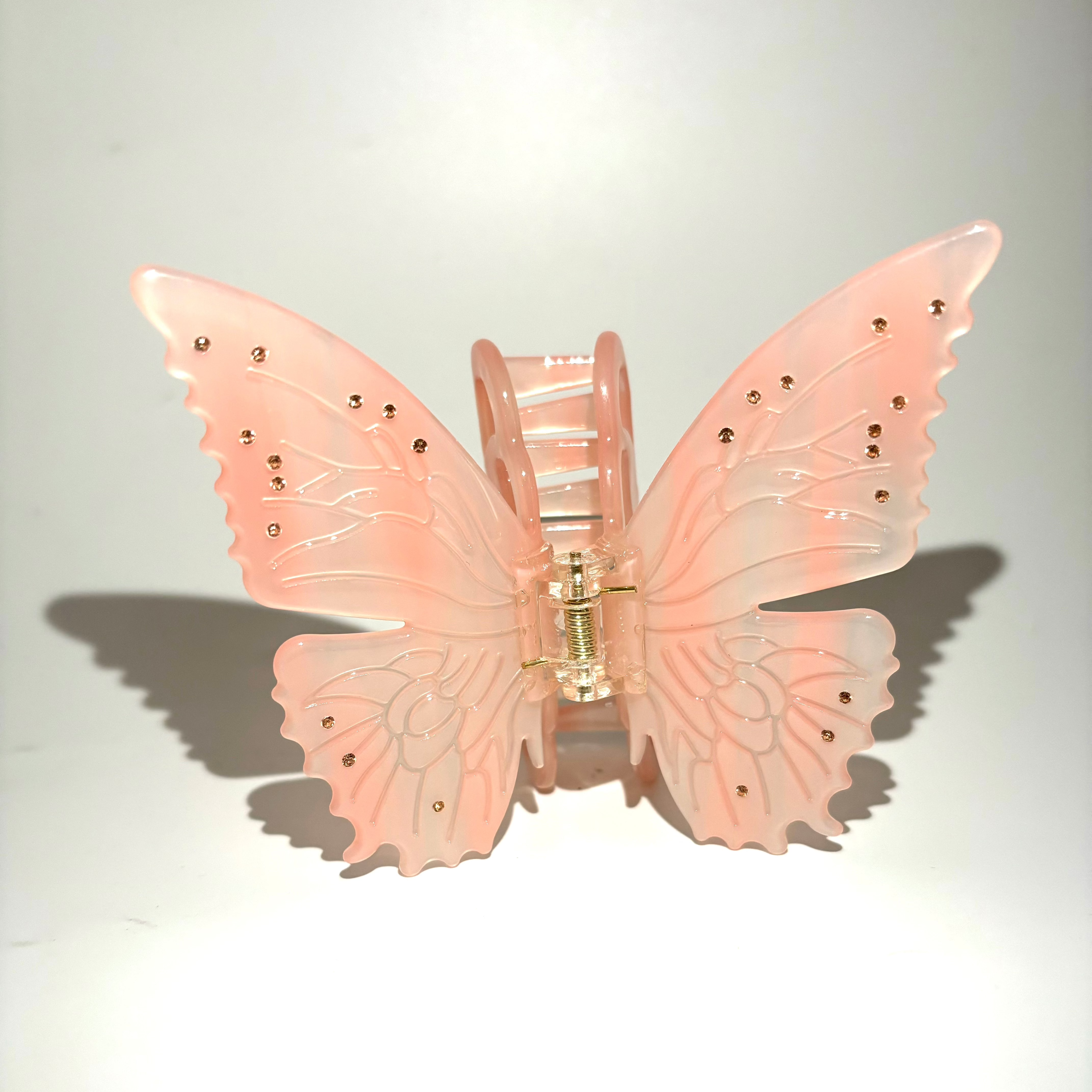 Pink light changing butterfly claw