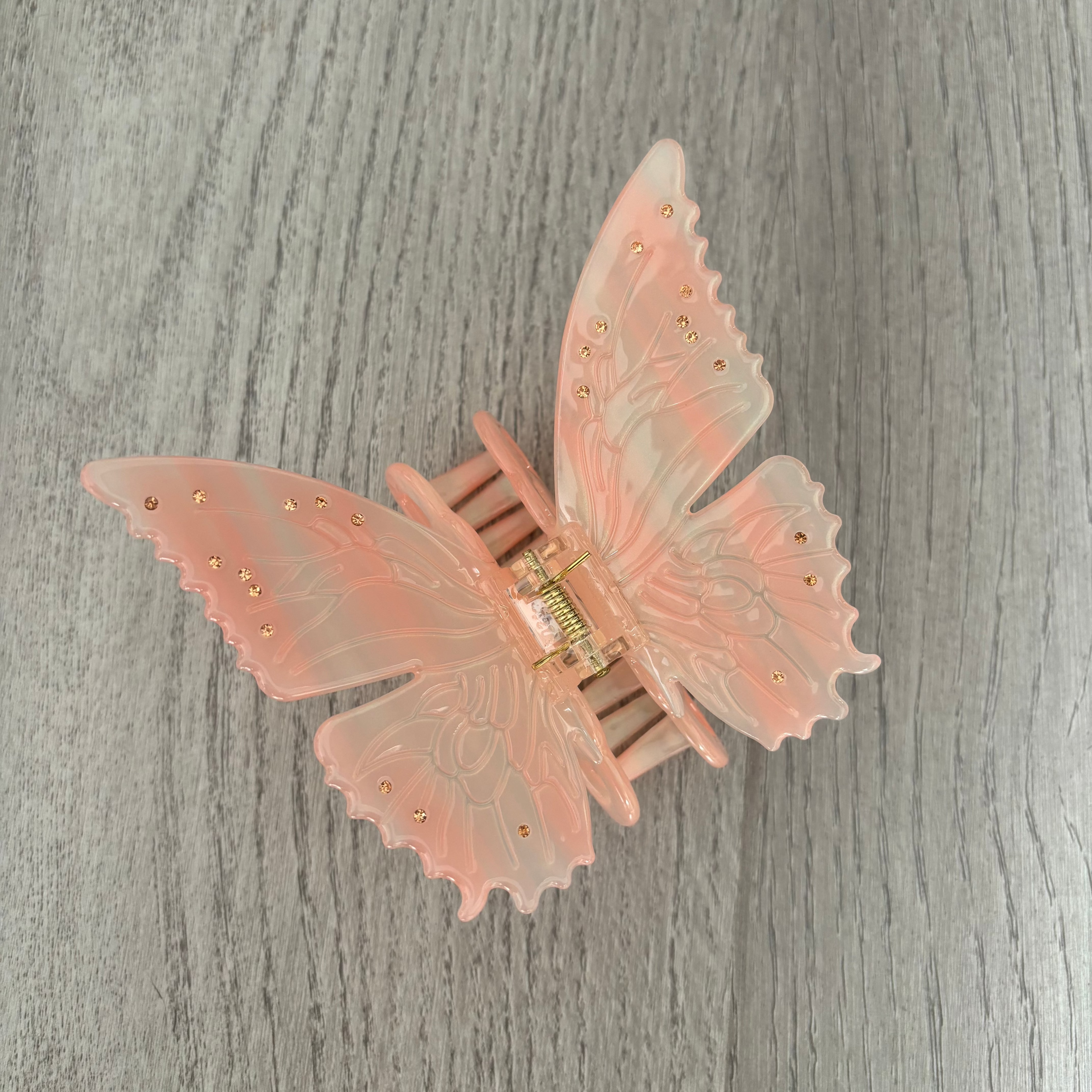 Pink light changing butterfly claw