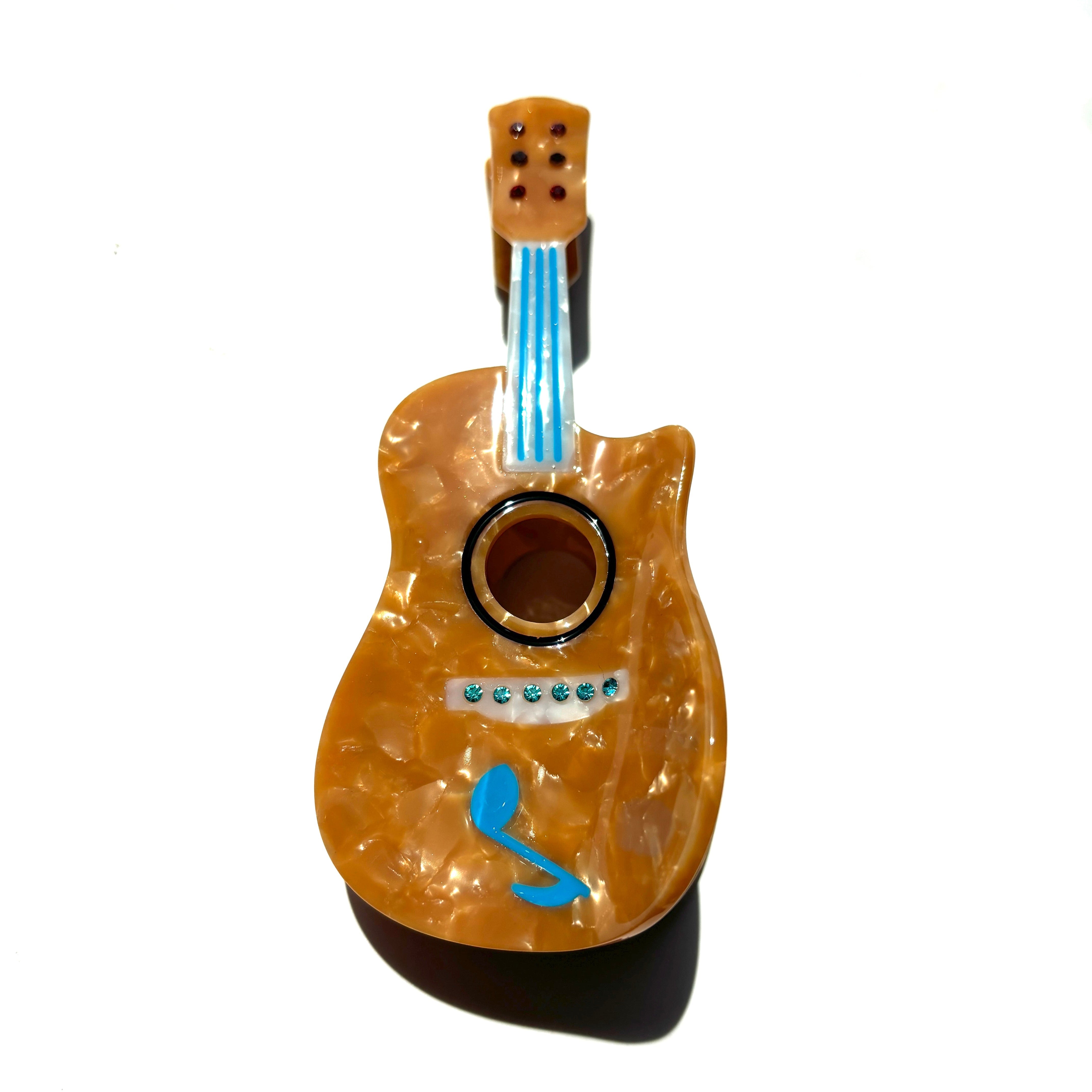 Orange guitar hair claw