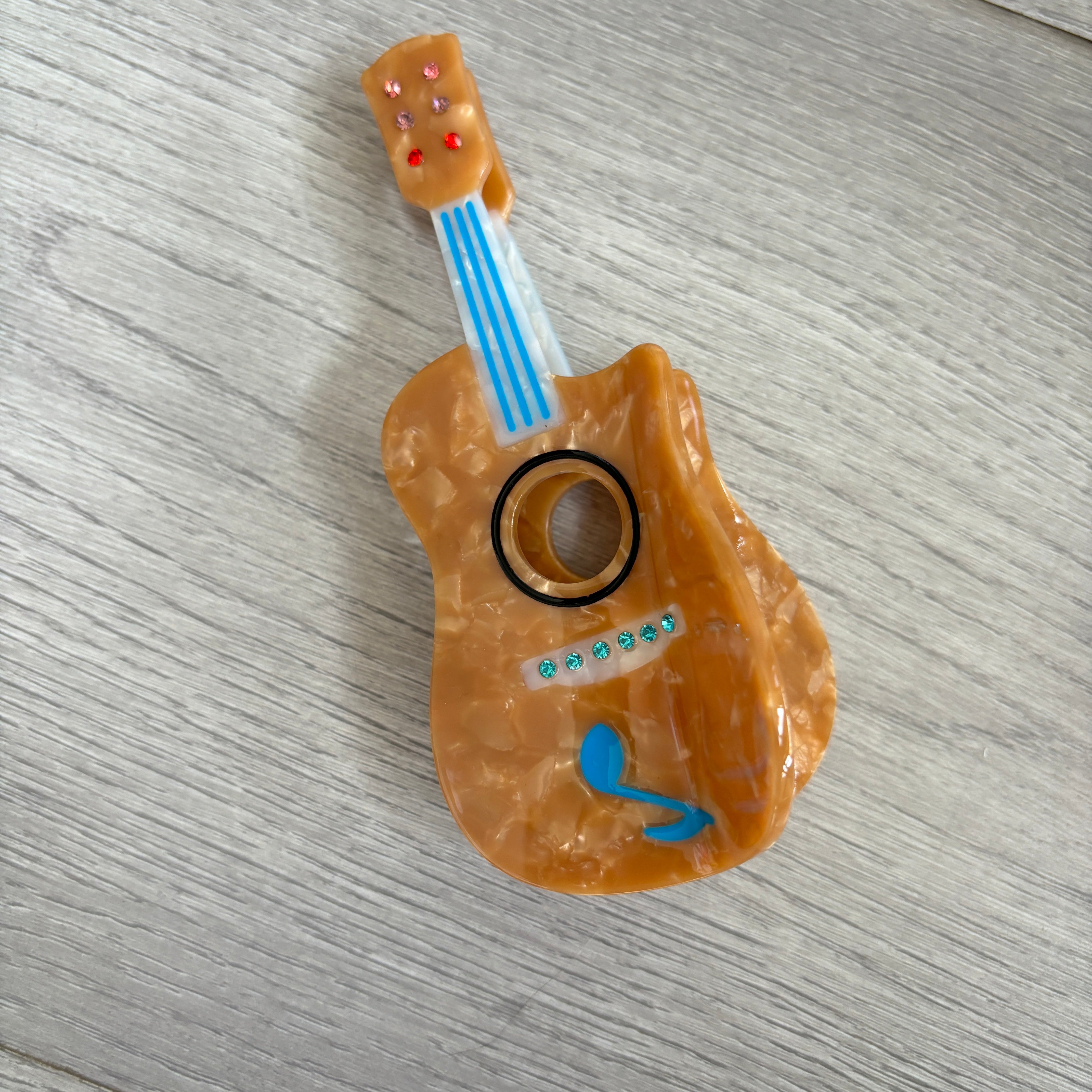 Orange guitar hair claw