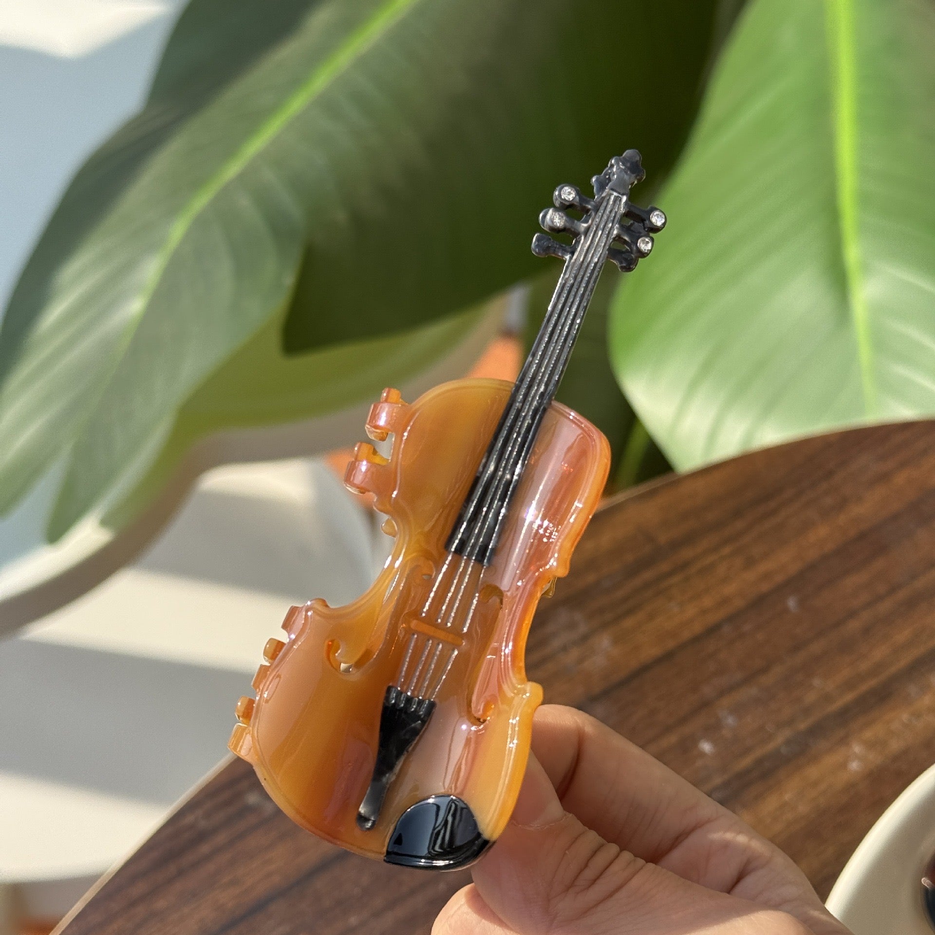 Brown violin hair claw