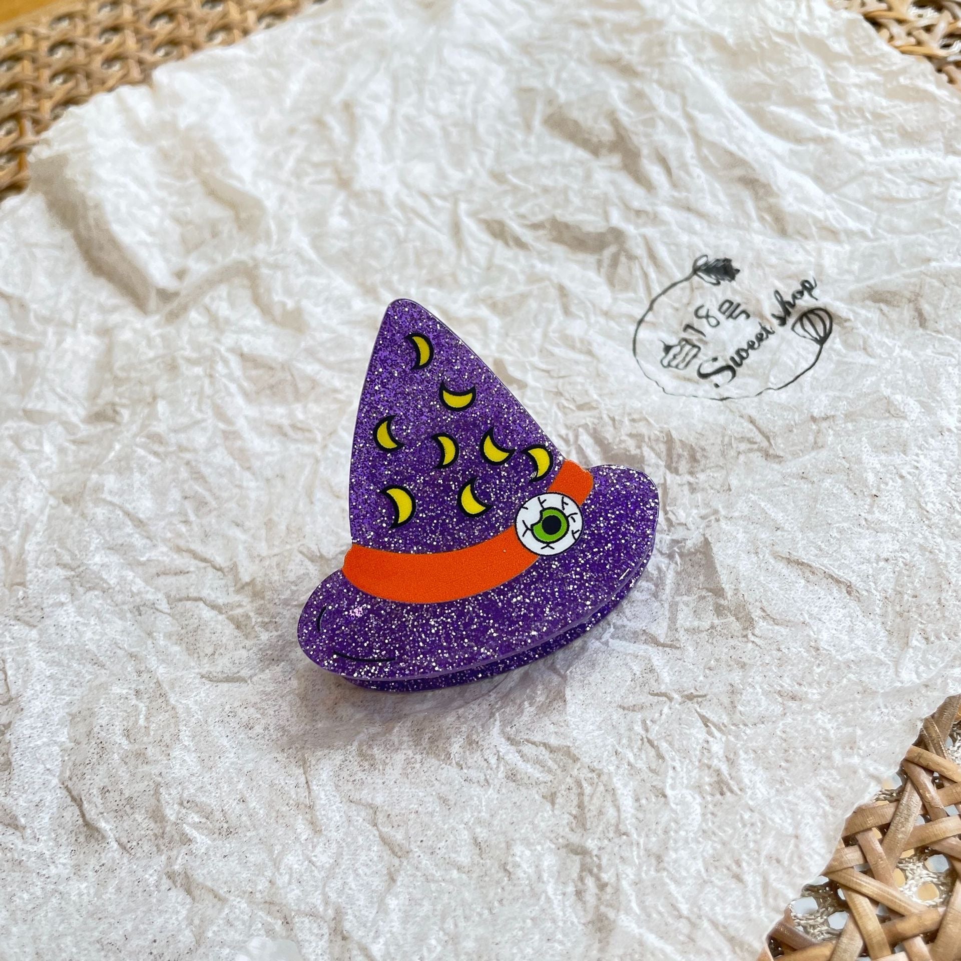 Magic hat within moon claw