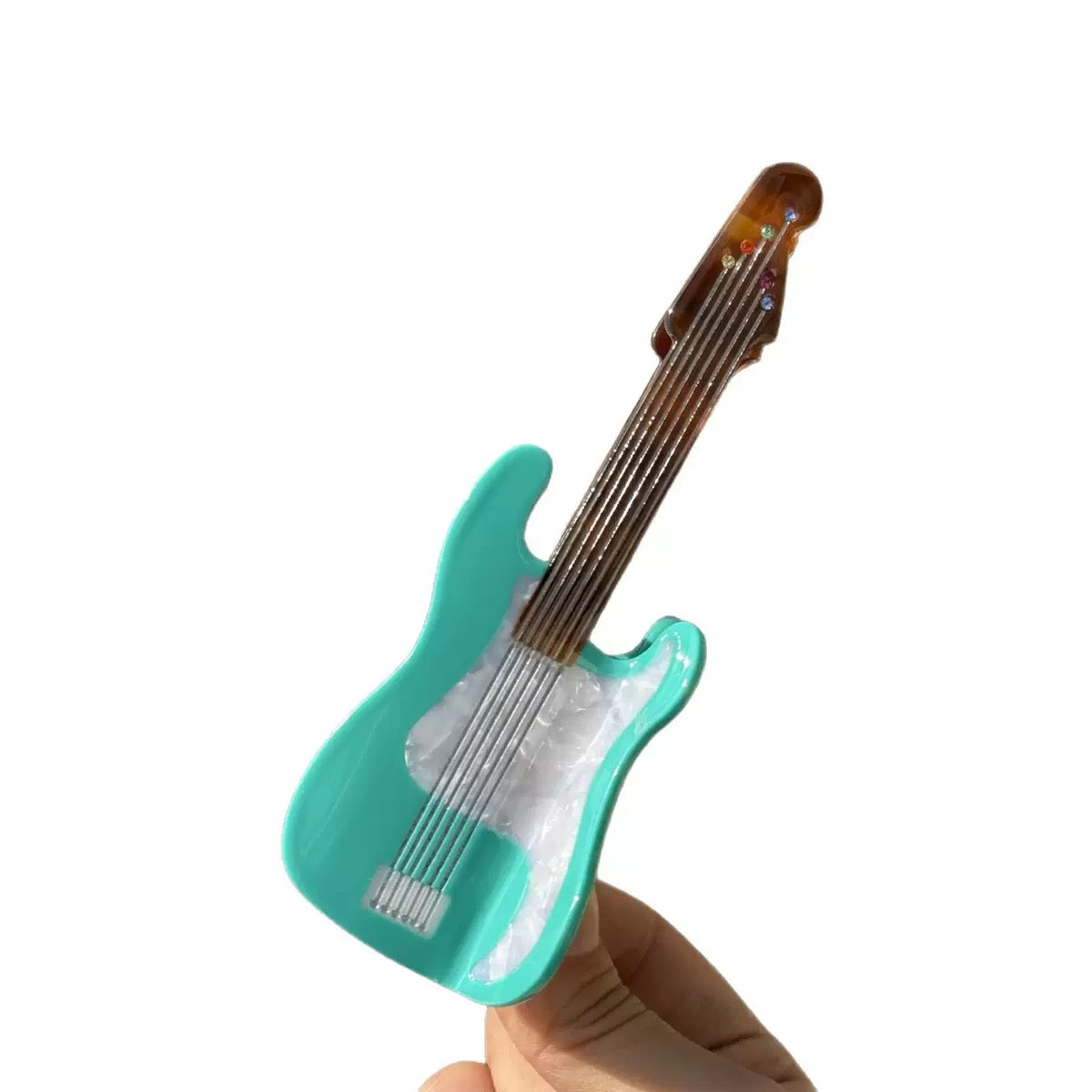 Mint green guitar hair claw