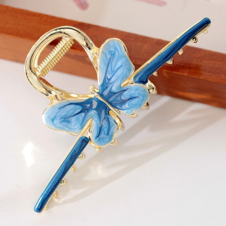 Gradient butterfly claw within blue