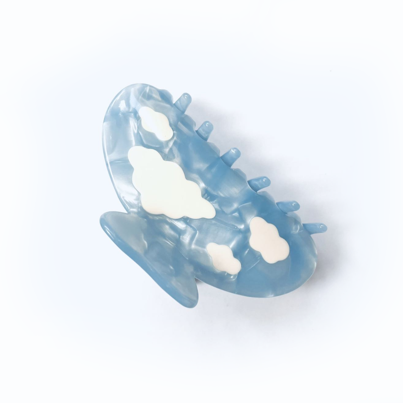 white clouds in the blue sky claw