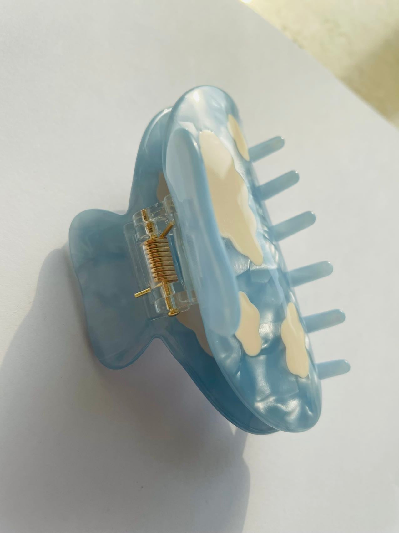 white clouds in the blue sky claw