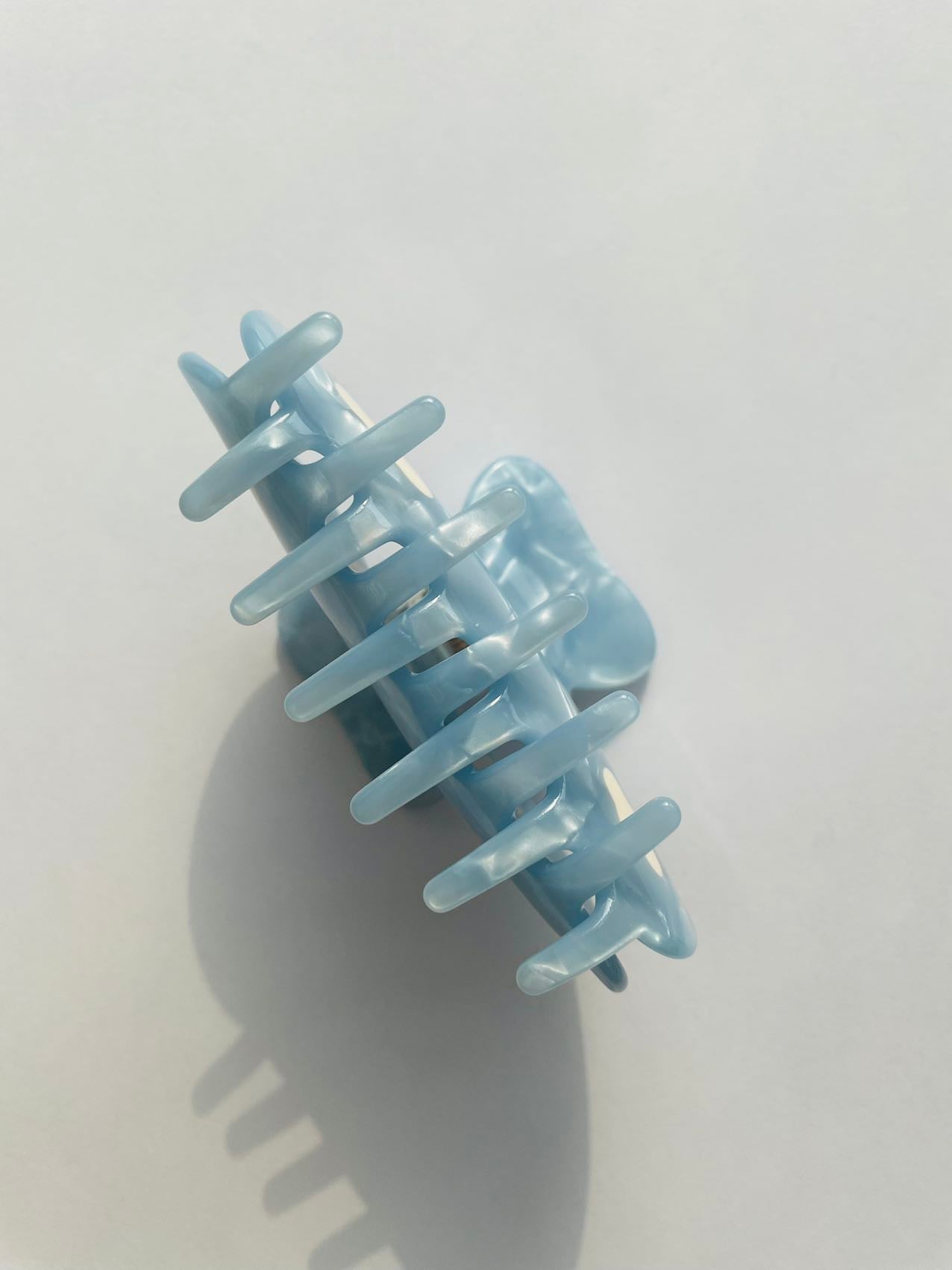 white clouds in the blue sky claw