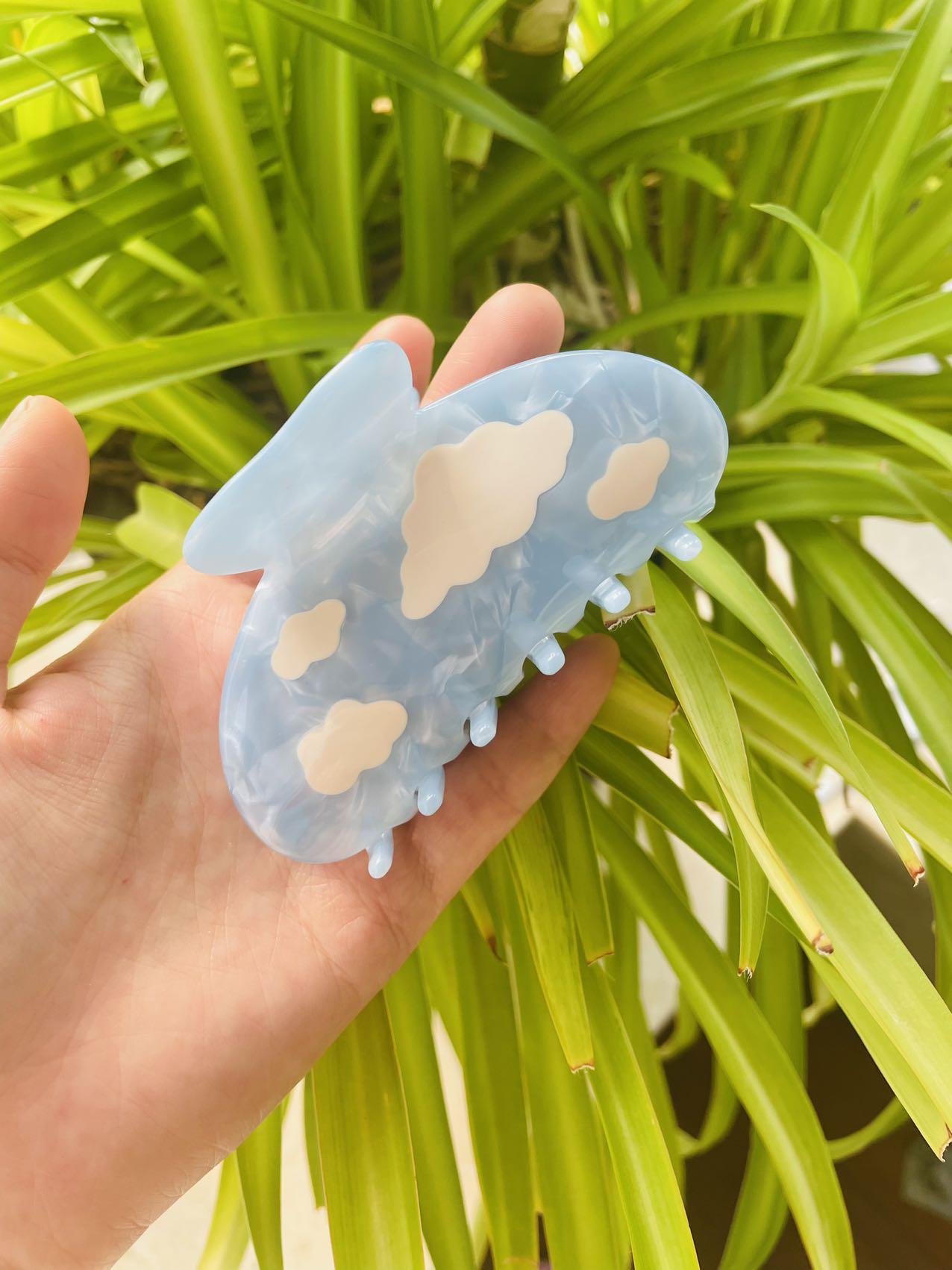 white clouds in the blue sky claw