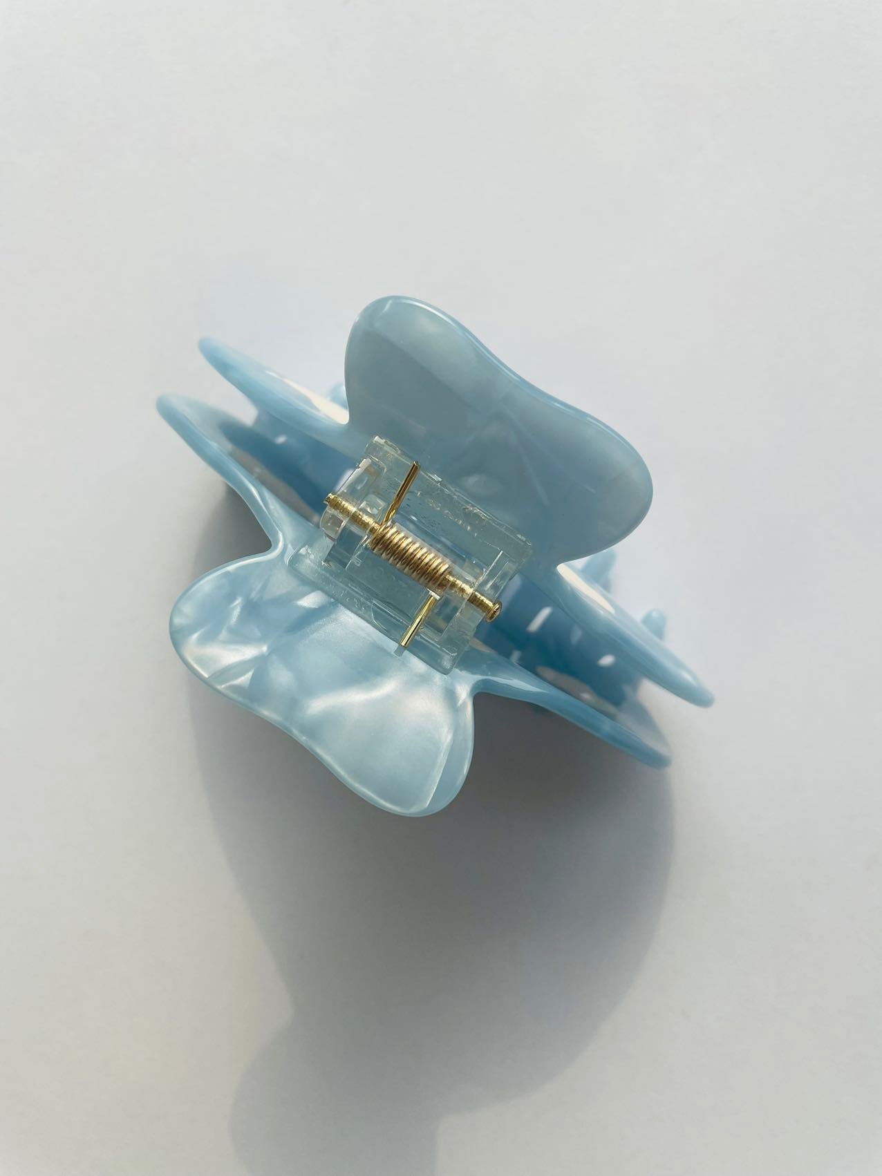 white clouds in the blue sky claw