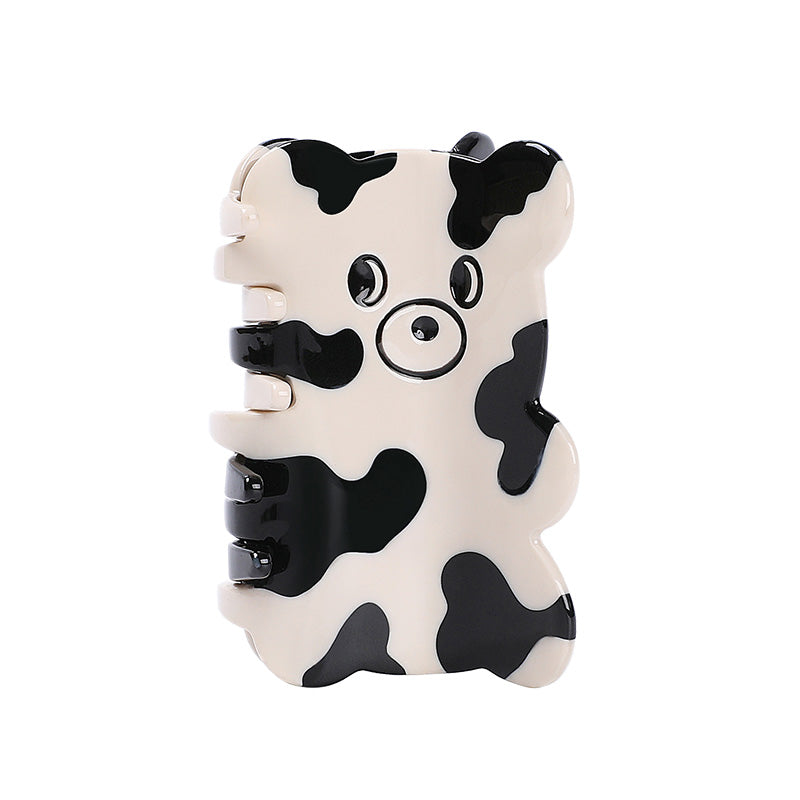 CURIOUS COW claw within pink