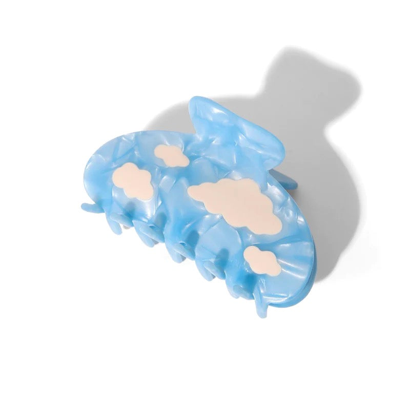 white clouds in the blue sky claw