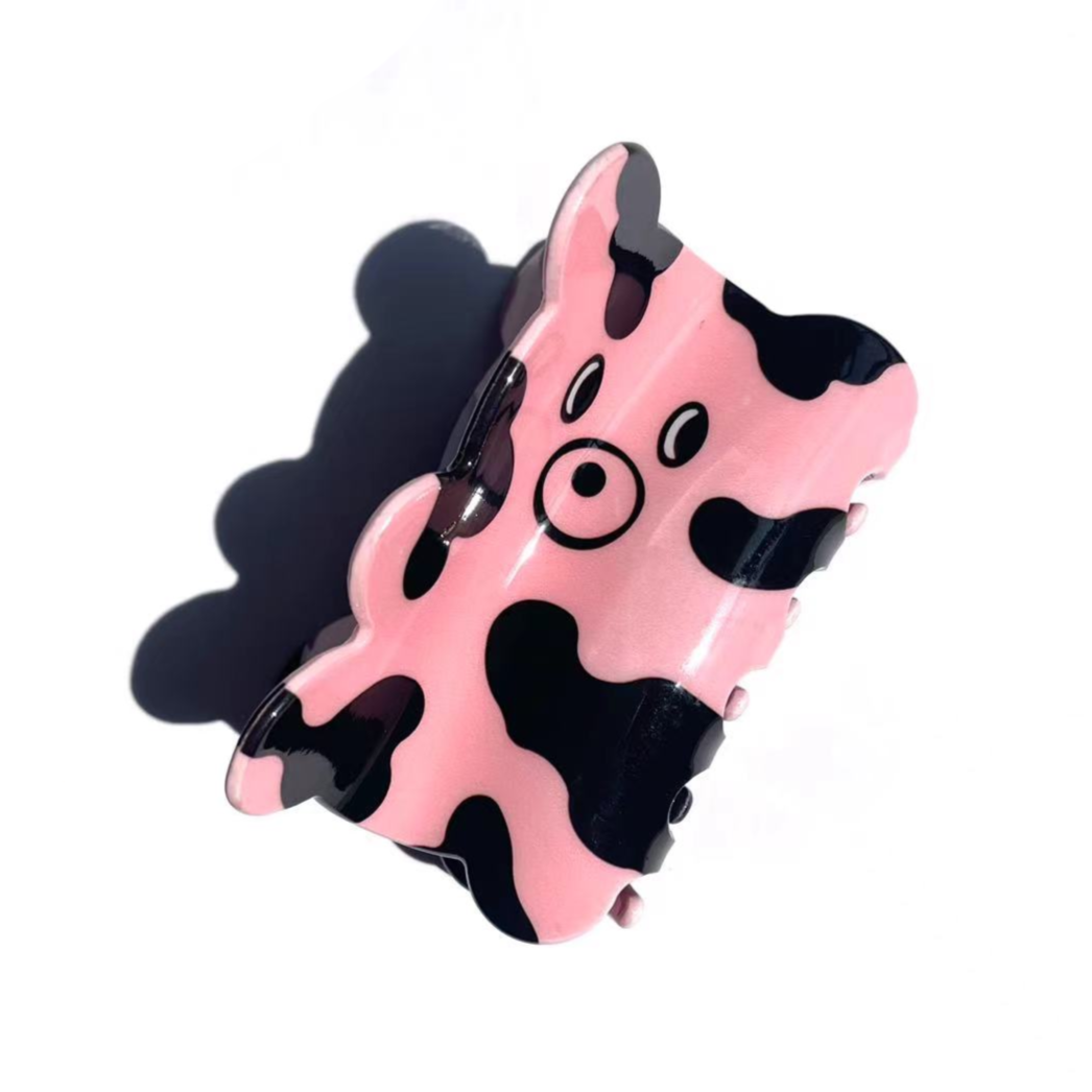 CURIOUS COW claw within pink