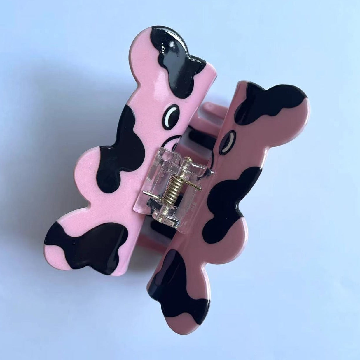 CURIOUS COW claw within pink