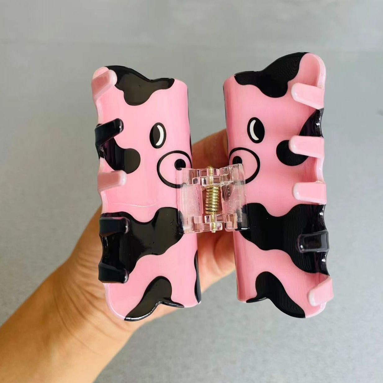 CURIOUS COW claw within pink