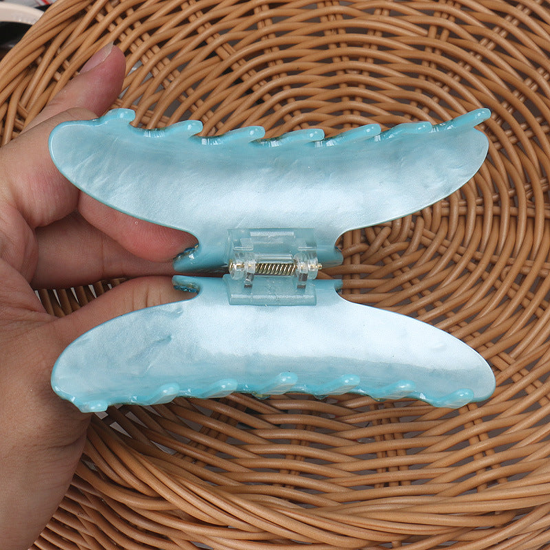 Handmade rhinestone claw within Blue