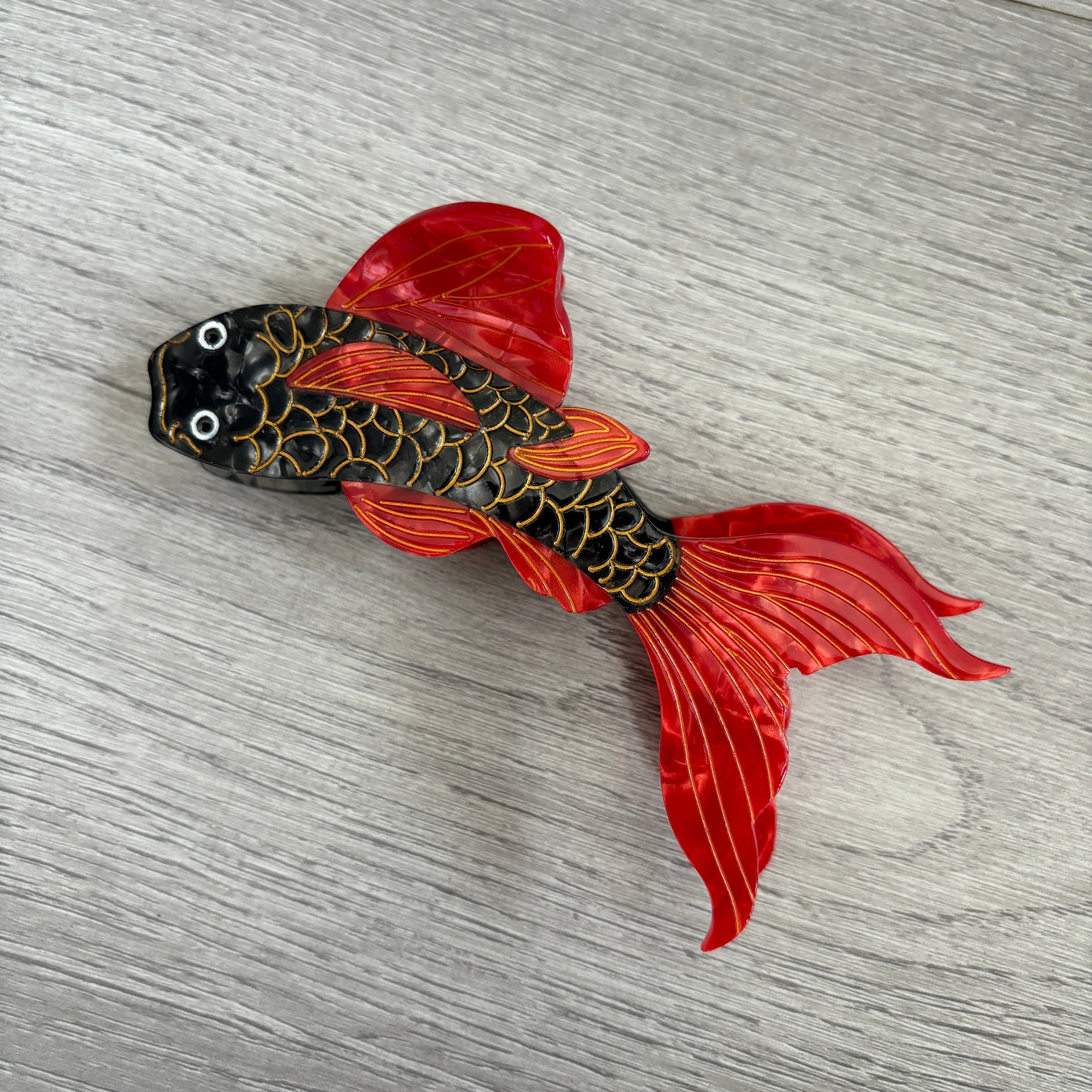 Black and red koi hair claw