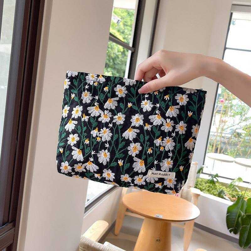White Daisy Makeup Bag within Black