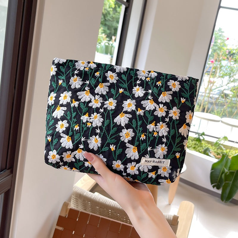 White Daisy Makeup Bag within Black